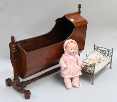 A Small Bisque Socket Head Doll, AM doll (second), Victorian mahogany dolls cradle on a turned stand