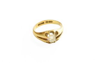 An 18 Carat Gold Diamond Solitaire Ring, the old cut diamond in a yellow claw setting, to a plain