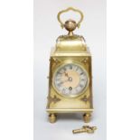 An Arts and Crafts Brass Carriage Timepiece, single barrel movement with a later platform lever