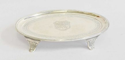 A George III Silver Teapot-Stand, by Henry Chawner, London, 1793, oval and on four tapering fluted