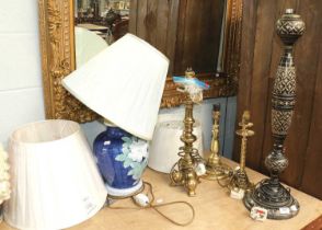 A Large Black Gilt and Enamel Table Lamp, dated 1970, three brass table lamps, three new modern