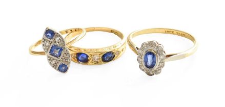 A Sapphire and Diamond Cluster Ring, the oval cut sapphire within a border of eight-cut diamonds, in