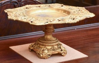 A Gilt Bronze Tazza, with scrolling openwork border adorned with crests, raised on a Neo-Classical