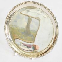 A George III Silver Waiter, by John Schofield, London, 1797, circular and on three tapering panel