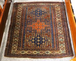 Durbend Rug, the indigo field with three cruciform medallions enclosed by ivory lattice borders,