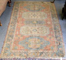 Machine Made Carpet of Caucasian Design, the terracotta field with five medallions enclosed by