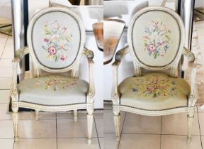 A Pair of French Painted Fauteuil, late 19th century, with floral decorated upholstery, (2)