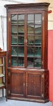 A Substantial George III Glazed Oak Standing Corner Cupboard, with dentil cornice over a blind