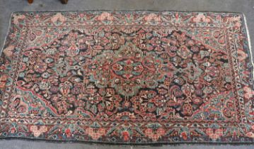 Mahal Rug, the field with a central medallion surrounded by vines enclosed by borders of plants,