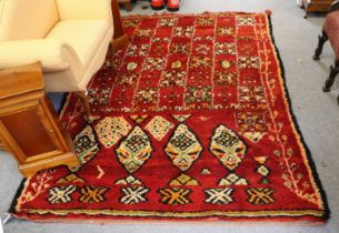 Moroccan Berber Carpet, the claret field comprised of geometric devices enclosed by narrow guard