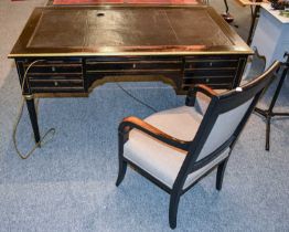 A Late 19th Century French Ebonised and Brass Mounted Leather Inset Writing Desk, on tapering fluted