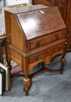 A Reproduction Walnut Bureau on Stand, in the William & Mary style, 77cm by 42cm by 105cm;