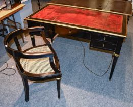 A Late 19th Century French Ebonised Writing Desk, with brass mounts and red leather writing surface,