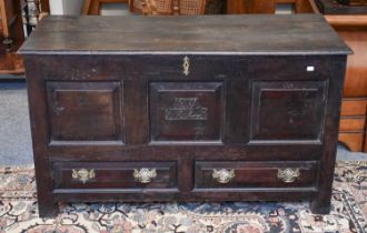 An Oak 18th century Mule Chest, front initialled and dated ''AW 1729'', 130cm by 55cm by 77cm