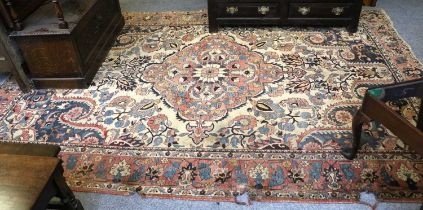 Bakhtiari Carpet, the ivory field with large flowers around a medallion framed by indigo spandrels