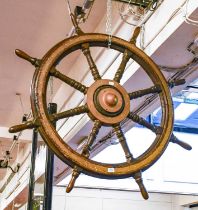 A 19th Century Large Ships Wheel, the eight-spoke wheel with brass centre and brass ring to the,