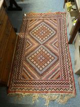 A Flat Weave rug, possibly Veramin, the field with two diamond lattice medallions enclosed by