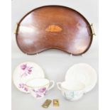 An Edwardian Mahogany Kidney Shaped Serving Tray, inlaid with shell patera; two large breakfast cups