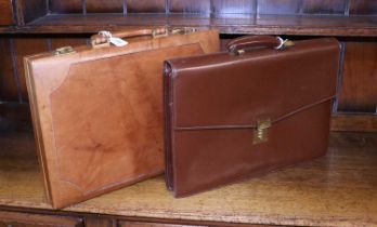 A Modern Tan Leather Hinged Briefcase, with gilt metal locks, leather handle, (with keys), 42cm by