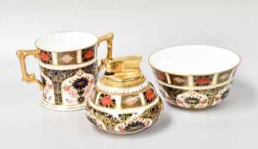 A Royal Crown Derby Porcelain Loving Cup, decorated in Imari pattern 1128, together with a sugar