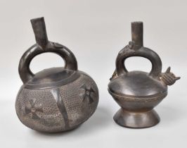 Two Peruvian Chimu Black Vessels, largest 26cm