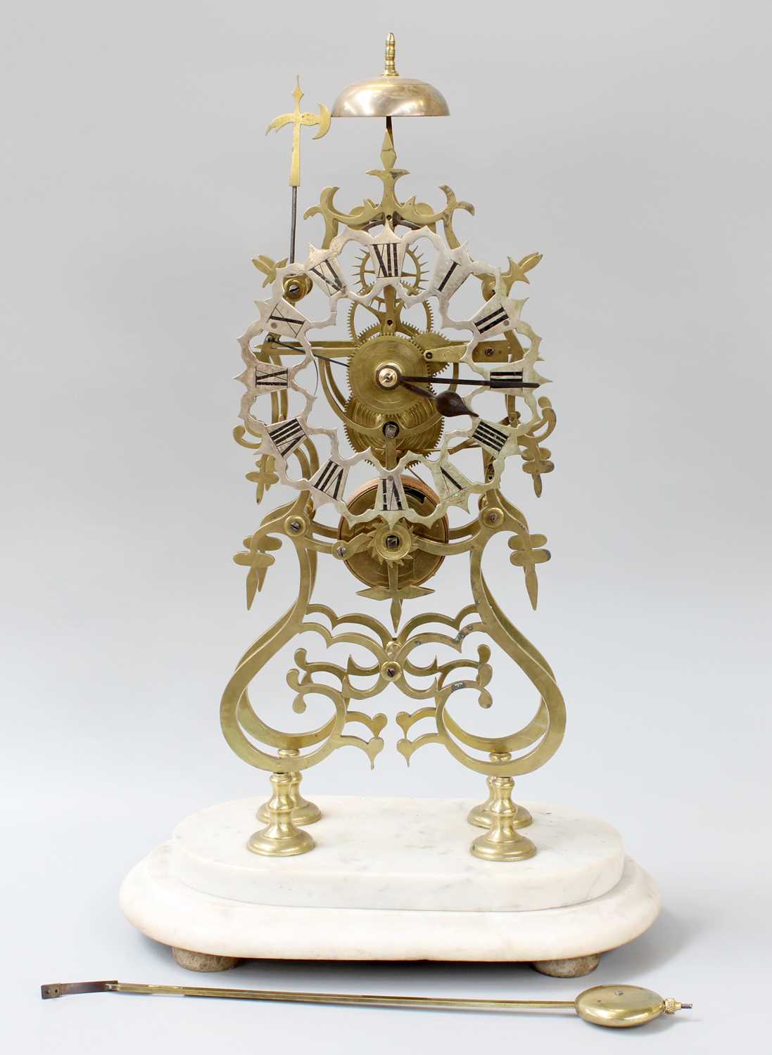 A Brass Single Fusee Skeleton Clock, with anchor escapement, passing strike on a bell and raised