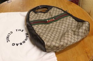 A Circa 1970/80s Gucci Supreme Monogram Canvas Bag, with rounded top, zip fastening, snaffle bit