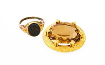 A 15 Carat Gold Citrine Brooch, the oval cut citrine in yellow quatrefoil design claw settings, to a