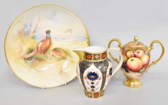A Maple & Co. Porcelain Twin Handled Urn and Cover, painted with fruit in the Royal Worcester style,