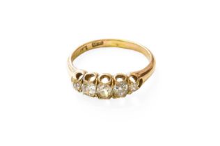 A Diamond Five Stone Ring, the graduated old cut diamonds in yellow claw settings, to a tapered