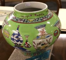 A Chinese Porcelain Vase, Jiajing reign mark but 20th century, ground in lime green and with vase
