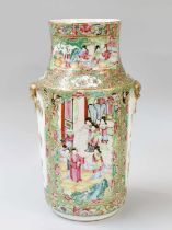 A Cantonese Porcelain Vase, mid 19th century, with moulded mask and loop handles, painted with