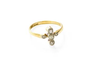 A Diamond Ring, the old cut diamonds arranged in a cross formation, in white millegrain settings, to