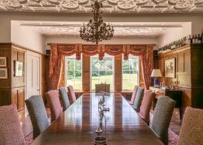 A Pair of Red and Gold Interlined 'Fortuny' Style Curtains and Pelmet, Rope Ties, 285cm drop by