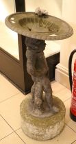 A Lead Figural Bird Bath, with dished top of gadrooned circular form, surmounted by a single bird,