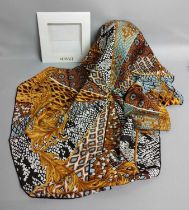 Versace Gold, Cream and Blue Silk Scarf, depicting radiating animal prints within gold scrolling