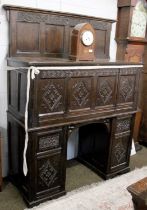 A Carved Oak Twin Pedestal Desk, early 20th century, comprised of period elements, the frieze