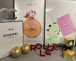 Collection of Chanel Christmas and Advertising Items comprising a three Christmas scene boxes, the