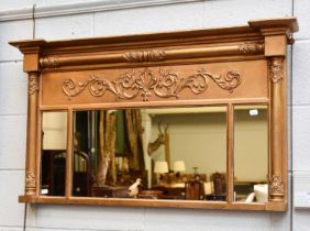 A Regency Inverted Breakfront Gilt Framed Sectional Mirror, 109cm by 62cm