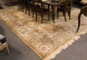 Chinese Carved Carpet, the champagne field with a central floral roundel medallion enclosed by