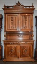 A 20th Century Continental Walnut Buffet Cabinet, with scrolling leaf surmounted and galleried