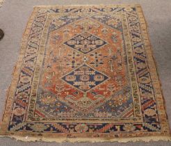 Early 20th Century Heriz Rug, the madder field with two diamond medallions surrounded by angular