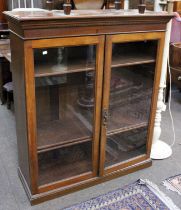 A Mahogany Glazed Bookcase, with adjustable shelves, 108cm by 39cm by 124cm