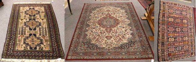 Baluch Rug, the camel field with three medallions enclosed by multiple narrow borders, 202cm by