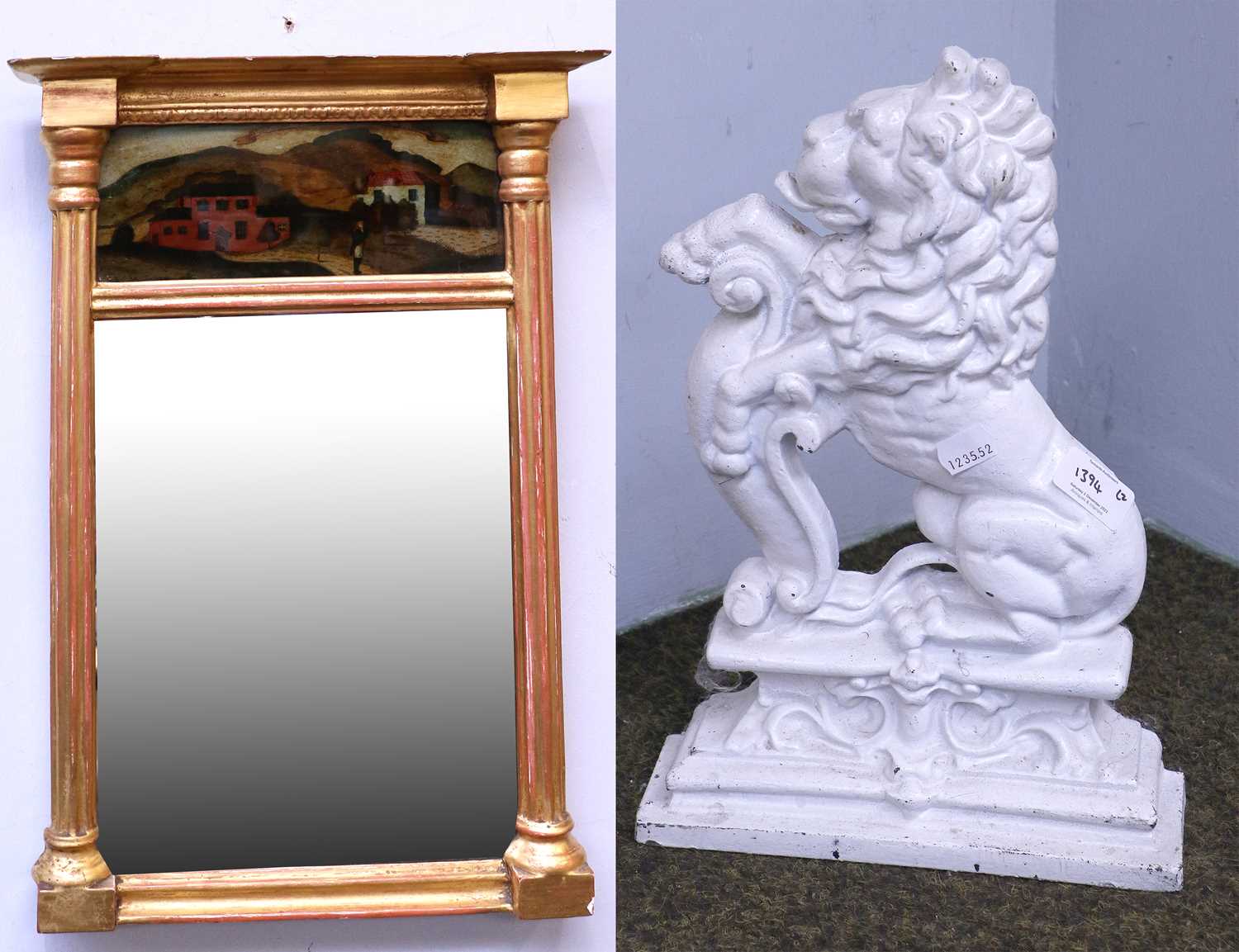 A Regency Style Gilt Framed Inverted Break Front Mirror, with a painted glass panel, 53cm by 34cm;