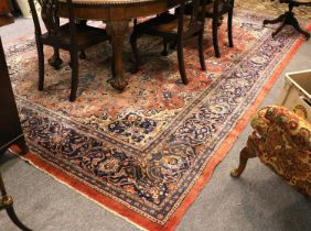 Saroukh Carpet, the faded strawberry field around a pale blue and ivory medallion, flanked by indigo