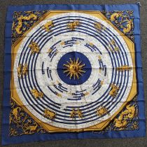 Hermès 'Dies Et Hore' Silk Scarf with zodiac signs and other astrology signs on a royal blue ground,