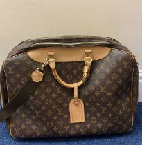 Louis Vuitton Monogram Alize 45 Travel Bag, designed with two main compartments both secured with