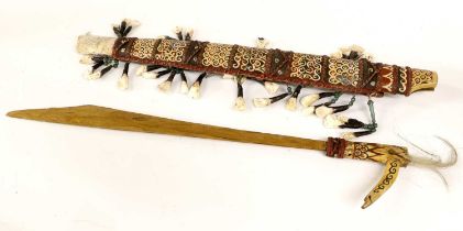 A Dyak Mandau (Headhunter's Sword), with later gilt painted steel blade, painted bone hilt and