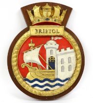 A Royal Navy Screen Badge to H.M.S. Bristol, in cast iron, cold painted in colours and gilt, mounted